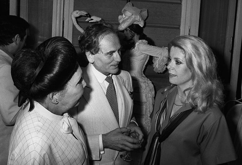 Pierre Cardin with Catherine Deneuve and Rosy Carita during a reception at the Ritz in Paris, in 1978. AFP
