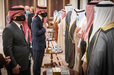 A handout picture released by the Jordanian Royal Palace on October 1, 2020 shows Jordan's King Abdullah II (L) and his son Crown Prince Hussein (2nd-L) offering their condolences to the Kuwaiti royal family while mask-clad due to the COVID-19 coronavirus pandemic, at the Emiri Terminal of Kuwait International Airport. - RESTRICTED TO EDITORIAL USE - MANDATORY CREDIT "AFP PHOTO / JORDANIAN ROYAL PALACE / YOUSEF ALLAN" - NO MARKETING NO ADVERTISING CAMPAIGNS - DISTRIBUTED AS A SERVICE TO CLIENTS / AFP / Jordanian Royal Palace / Yousef ALLAN / RESTRICTED TO EDITORIAL USE - MANDATORY CREDIT "AFP PHOTO / JORDANIAN ROYAL PALACE / YOUSEF ALLAN" - NO MARKETING NO ADVERTISING CAMPAIGNS - DISTRIBUTED AS A SERVICE TO CLIENTS