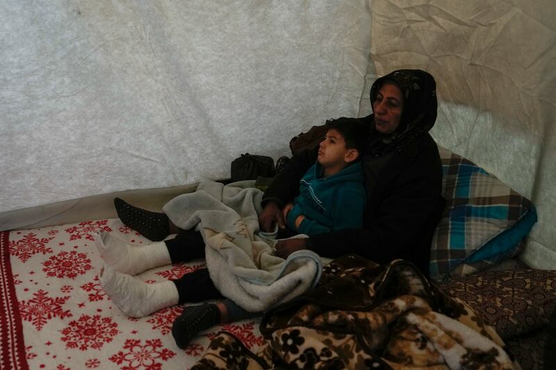 A Syrian woman takes care of her nephew Hasan Goayid, eight, in Islahiye district, Gaziantep. AP