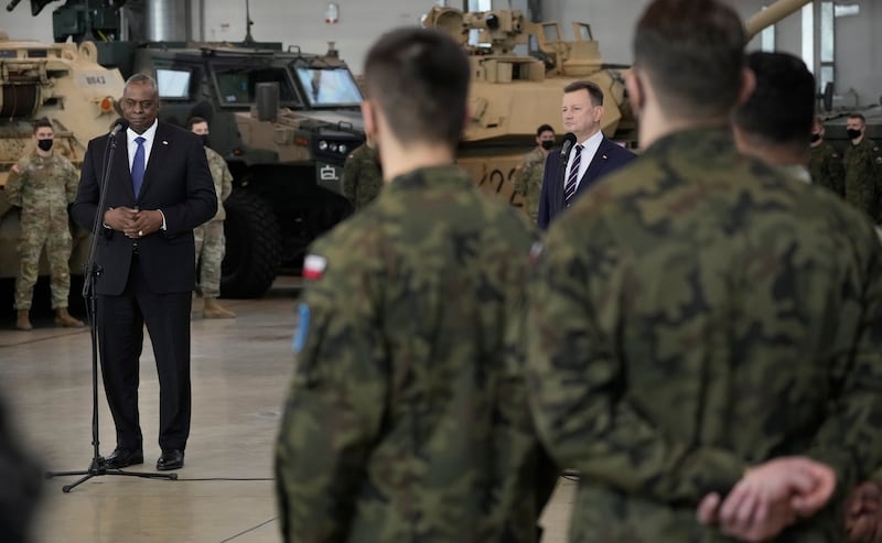 Mr Austin, left, addresses US troops stationed at the Powidz Air Base in Poland. AP Photo