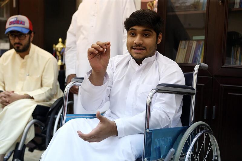 Saud Rahmatallah, 15, has been a club member for a year. Although he is unable to walk because of  infantile paralysis, he has become an accomplished competition shot-putter. Satish Kumar / The National