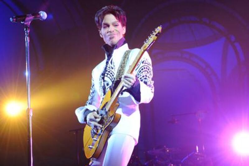 US singer Prince performs on October 11, 2009 at the Grand Palais in Paris. Prince has decided to give two extra concerts at the Grand Palais titled "All Day/All Night" after he discovered the exhibition hall during Karl Lagerfeld's Chanel fashion show. AFP PHOTO BERTRAND GUAY