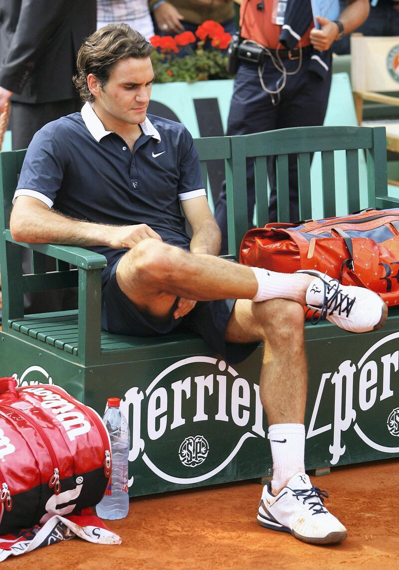 PARIS - JUNE 08:  A dejected Roger Federer of Switzerland looks on followinghis defeat during the Men's Singles Final match against Rafael Nadal of Spain on day fifteen of the French Open at Roland Garros on June 8, 2008 in Paris, France.  (Photo by Julian Finney/Getty Images)
