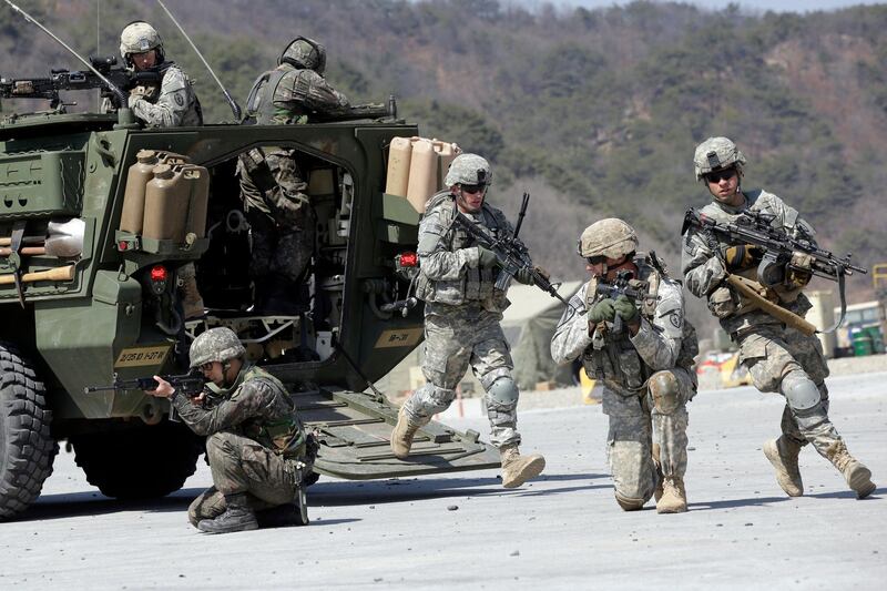 US Army soldiers from the 25th Infantry Division's 2nd Stryker Brigade Combat Team and South Korean soldiers take their positions during a demonstration of the combined arms live-fire exercise. AP, File