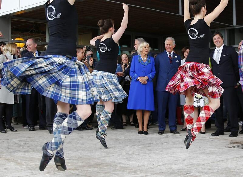 Britain’s Prince Charles and Camilla, Duchess of Cornwall, watch traditional dancers in Halifax, Nova Scotia on May 19, 2014. Prince Charles and his wife Camilla, Duchess of Cornwall, are on a four-day visit to Canada. Mark Blinch / Reuters