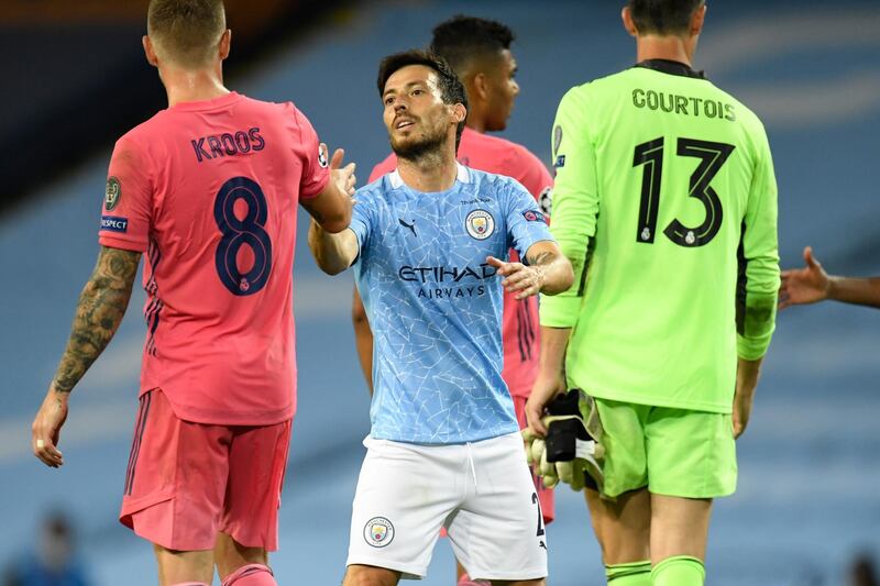 Manchester City's David Silva shakes hands with Real Madrid's Toni Kroos at the end of the Champions League match at the Etihad Stadium in Manchester. AP