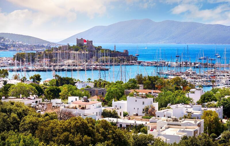 View of Bodrum castle and Marina Harbor in Aegean sea in Turkey