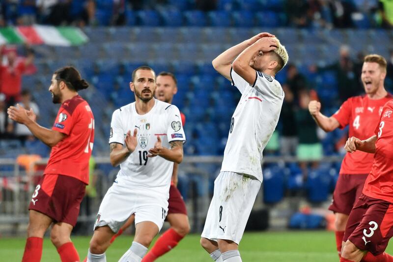 Italy midfielder Jorginho reacts after missing a penalty. AFP