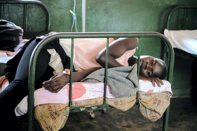 A patient rests on a bed after being discharged from the malaria ward at Panyadoli Health Center III in Kiryandongo refugee settlement, northwestern Uganda, on April 11, 2017. 
A new malaria vaccine will be tested on a large scale in Kenya, Ghana and Malawi, the World Health Organization said on April 24, 2017, with 360,000 children to be vaccinated between 2018 and 2020. The injectable vaccine RTS,S could provide limited protection against a disease that killed 429,000 people worldwide in 2015, with 92 percent of victims in Africa and two-thirds of them children under five.  / AFP PHOTO / Esther MABABZI