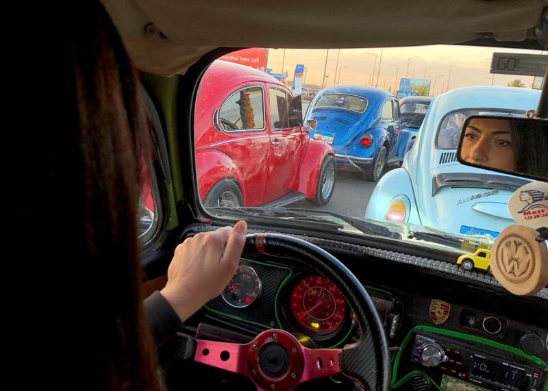 Egypt Beetle Club's Ghada El Ataar joins other VW fans as they take part in their weekly Cairo rally. Reuters