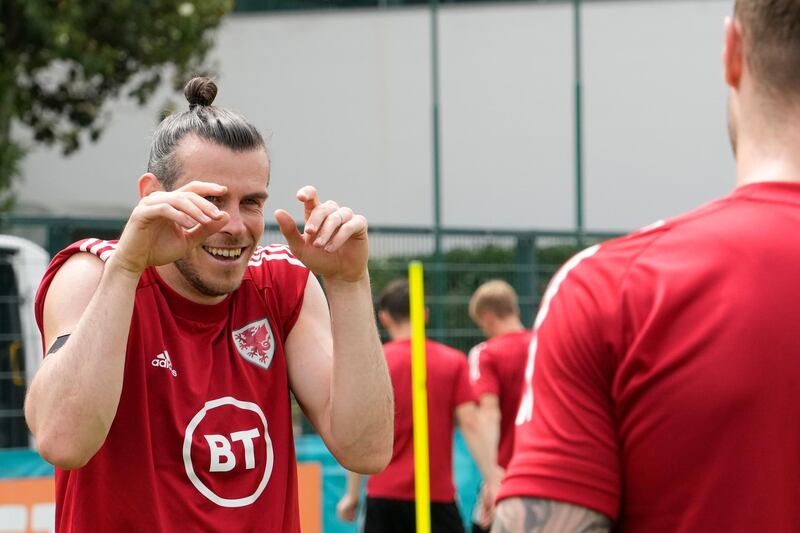 Gareth Bale, left, jokes with Wales teammate Joe Rodon during a team training session at Rome's Acqua Acetosa. AP