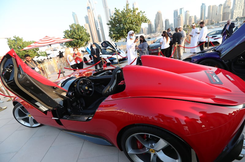 Visitors inspect the exhibition of NoFilterDXB outdoor urban motoring festival as the new phase of Dubai International Motor Show in Dubai, United Arab Emirats on 24 November 2021.  NoFilterDXB festival is running from 24 till 27 November 2021.   EPA / ALI HAIDER