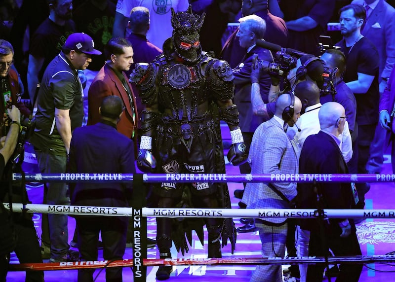 Deontay Wilder enters the ring prior to the Heavyweight bout wearing a design by Cosmo & Donato. AFP