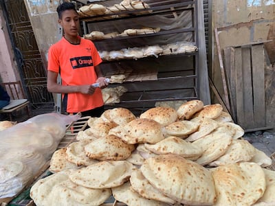 A street vendor selling freshly baked bread in the Al Azhar district in Cairo’s medieval quarter. April 25. Photo by Hamza Hendawi