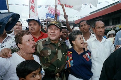 Manuel Antonio Noriega walks with supporters in the Chorrilo neighbourhood of Panama City in May 1989. AP