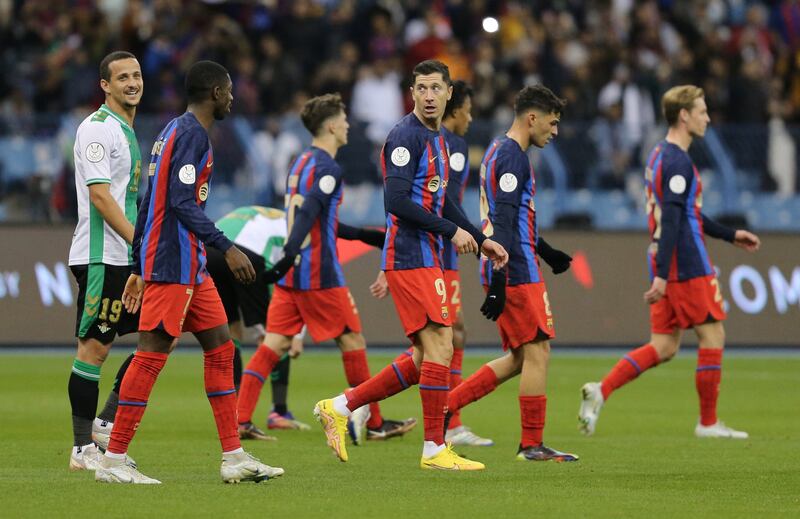 Barcelona's Robert Lewandowski celebrates scoring their first goal with teammates. Reuters
