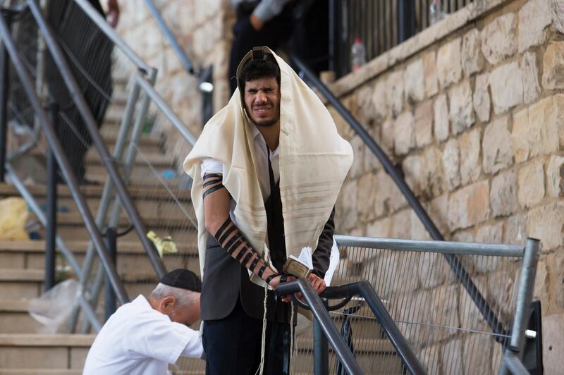 An Orthodox Jew prays after after dozens killed in  a crush at the Lag BaOmer religious festival in Mount Meron. Getty Images