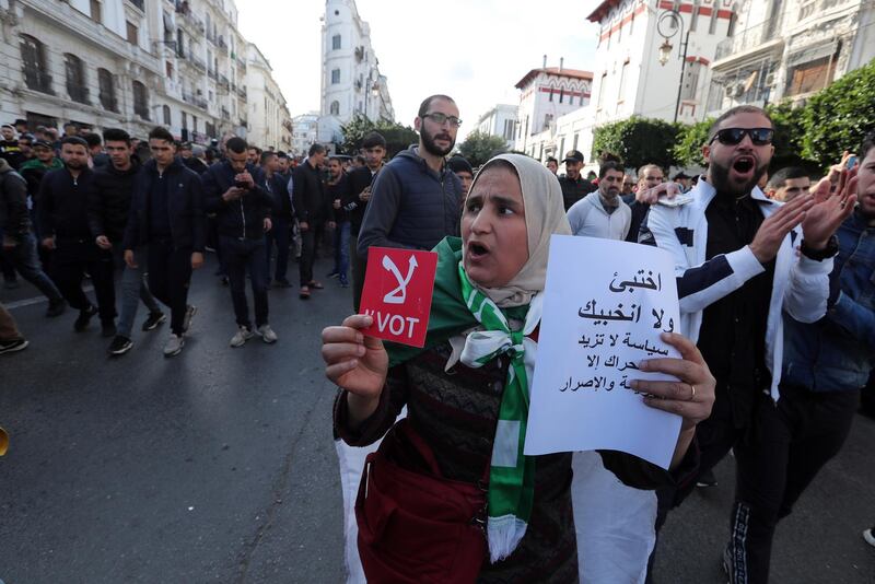 Algerians chant slogans during a protest rally in Algiers, Algeria. Thousands of people have taken to the streets in the capital Algiers calling for a mass boycott of the country's presidential elections, which is taking place on the day, and to voice against the five candidates running to replace ousted president Abdelaziz Bouteflika for being closely linked to the former regime.  EPA