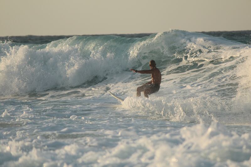 Surf Camp Egypt partner Ahmed Shams taking a wave at Hacienda Red. Photo: Tulip Afifi