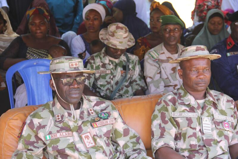 Nigerian Military officials are seen during an official ceremony, at the Giwa military barracks, where inmates  were released and handed over to  state officials for rehabilitation and integration after they were detained for up to four years over suspicion of links with Boko Haram jihadists in Maiduguri , on November 27, 2019. A total of 983 people incarcerated in a military facility in the northeast Nigerian city of Maiduguri were handed over to state officials for rehabilitation and integration.
Human rights groups have accused the Nigerian Military of indiscriminate mass arrests of innocent citizens in northeast Nigeria as it battles Boko Haram. / AFP / Audu Marte
