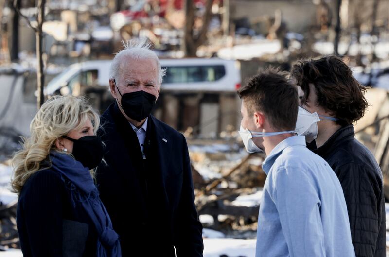 US President Joe Biden and first lady Jill Biden tour a neighbourhood in Louisville, Colorado, Reuters