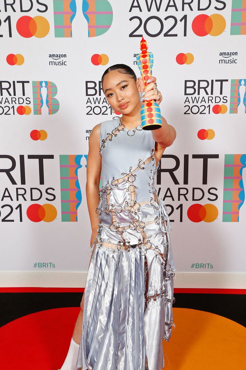 Griff changed into a blue embellished gown to accept her Rising Star award at the Brits 2021. AFP