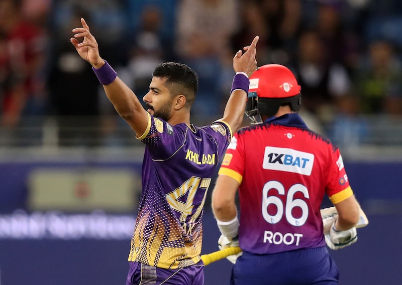 Abu Dhabi Knight Riders' Ali Khan takes the wicket of Dubai Capitals' Joe Root during the first game of the International League T20 at the Dubai International Stadium on Friday, January 13, 2023. All photos by Chris Whiteoak / The National