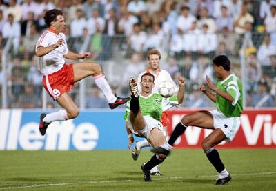 Marco Van Basten of the Netherlands challenges Hossam Hassan of Egypt during their Group F match of the 1990 FIFA World Cup on 12 June 1990 at the Giuseppe Meazza Stadium in Palermo, Italy. The match resulted in a 1-1 draw. (Photo by David Cannon/Getty Images) 