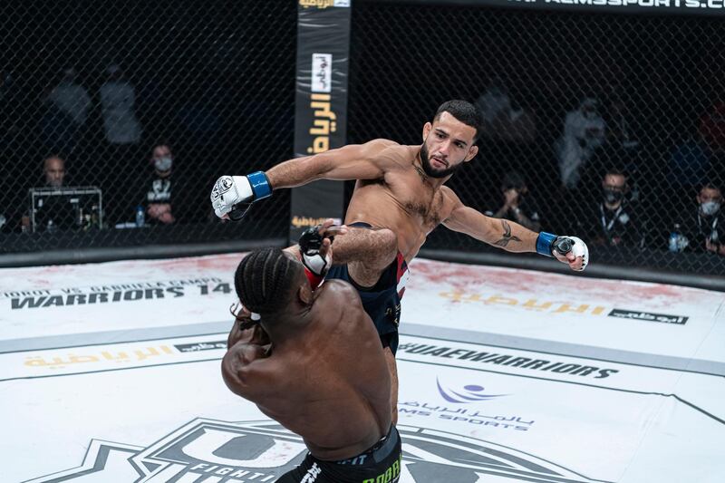 Xavier Alaui lands a high kick on Jaures Dea in the UAE Warriors-14 bantamwight world title at the Jiu-Jitsu Arena in Abu Dhabi on Friday, November 27, 2020. Courtesy Palms Sports