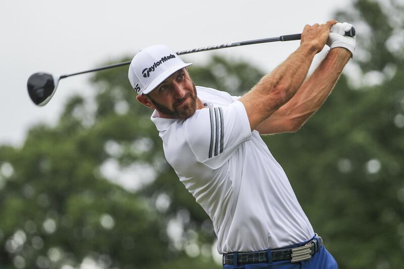 epa06133844 Dustin Johnson of the US hits a tee shot on the first hole during a practice round for the 99th PGA Championship golf tournament at Quail Hollow Club in Charlotte, North Carolina, USA, 09 August 2017.  EPA/TANNEN MAURY