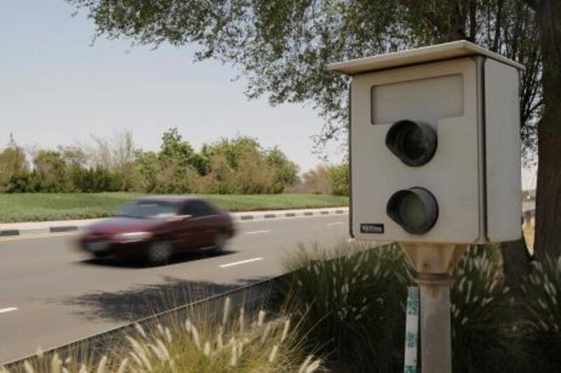 AL AIN, UNITED ARAB EMIRATES - May 28, 2009: Traffic passes a speed camera in Al Ain.
( Ryan Carter / The National )

** stock, speed, cars, trucks, speed camera *** Local Caption ***  RC011-speedcamera.JPGRC011-speedcamera.JPGRC011-speedcamera.JPG