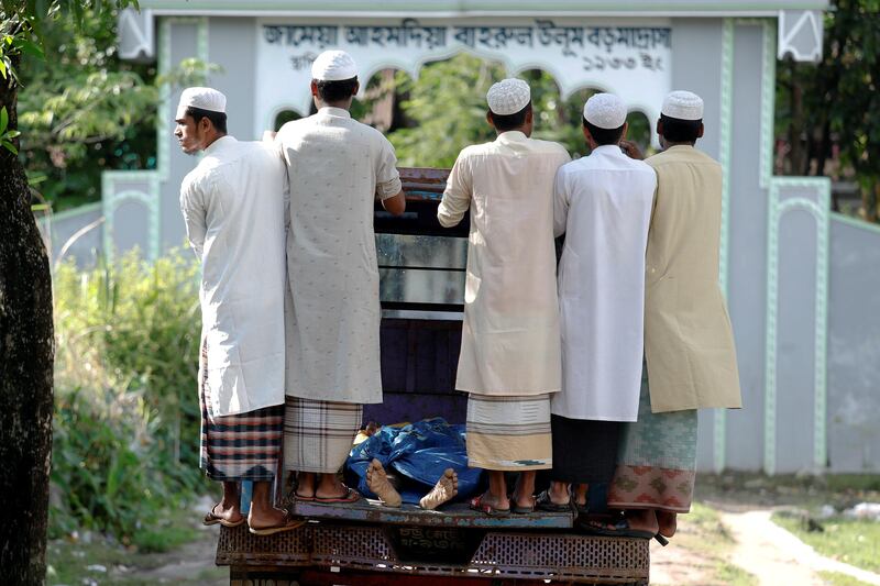 Bodies of Rohingya refugees from Myanmar, who were killed when their boat capsized on the way to Bangladesh, are brought to a local madrasa in Shah Porir Dwip, in Teknaf, near Cox's Bazar in Bangladesh. Damir Sagolj / Reuters