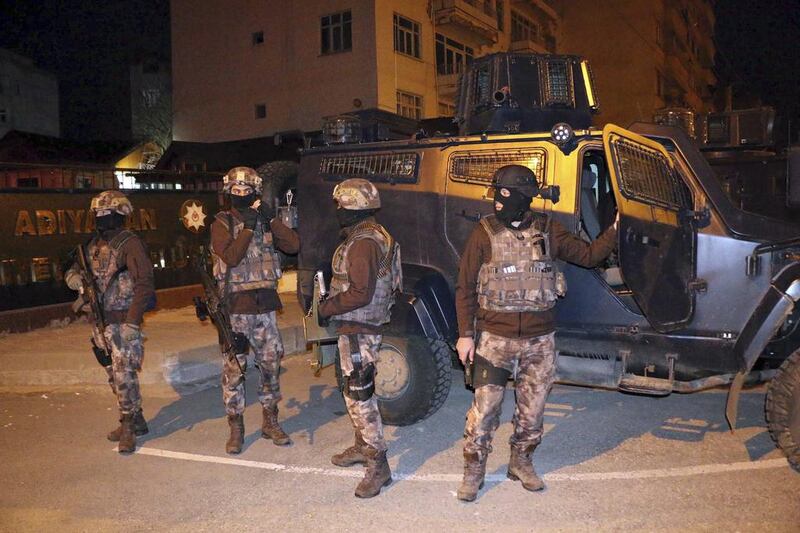 Turkish anti-terrorism police stand by their armoured vehicle during an operation to arrest people over alleged links to ISIL, in Adiyaman, southeastern Turkey, on Sunday, February 5, 2017. Mahir Alan / Dha-Depo Photos via AP