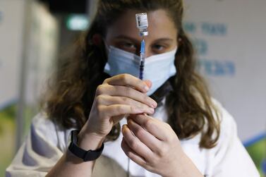 An Israeli medical worker prepares to administer a Covid-19 vaccine in Jerusalem. Reuters