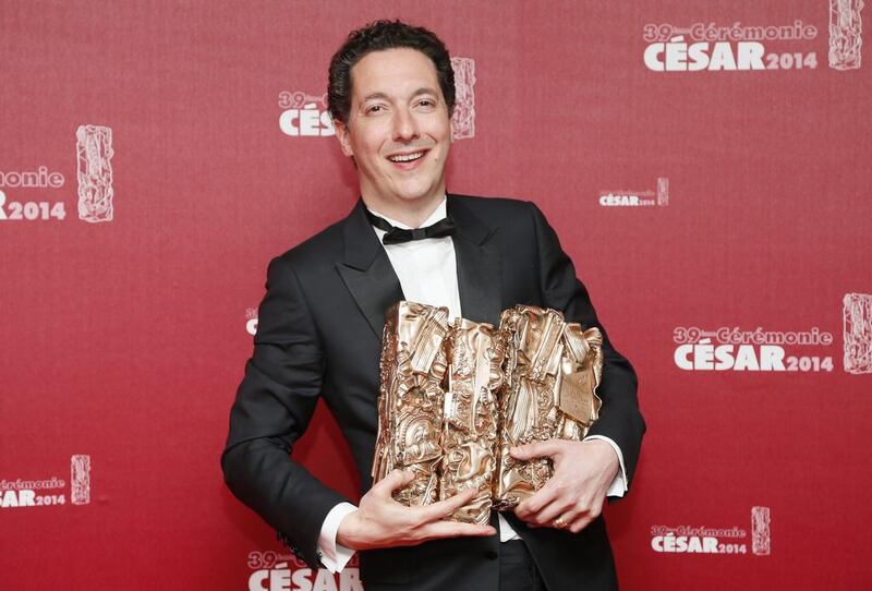 French actor and director Guillaume Gallienne poses with four of his five trophies after winning Best Film, Best First Film, Best Adaptation, Best Actor and Best Film Editing, for his film ‘Les Garcons et Guillaume, a table.’ Ian Langsdon / EPA