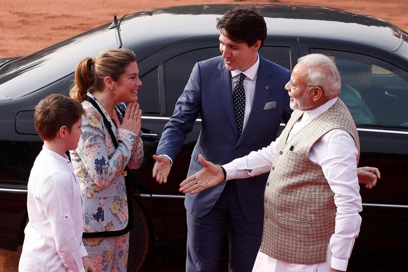 Mr Modi extends his hand to Mr Trudeau's wife, Sophie. Adnan Abidi / Reuters