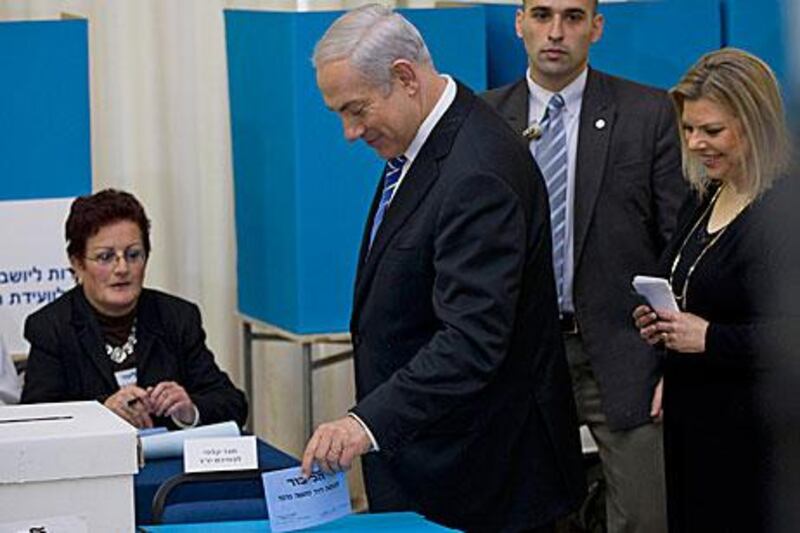 Israel’s prime minister, Benjamin Netanyahu, votes in the Likud party primary elections in Jerusalem yesterday.