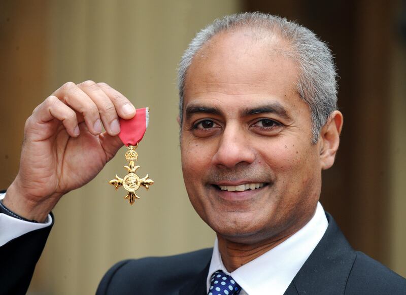 Newsreader George Alagiah at Buckingham Palace after collecting his OBE from the queen in 2008. PA