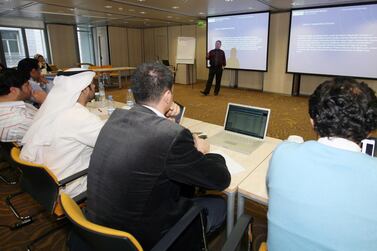 Students of the Cass Business School, University of London, Executive MBA Dubai Programme, listen to a lecture by Rob Melville, a Cass professor based in London, at a workshop at the DIFC in Dubai on January 18, 2009. Randi Sokoloff / The National
