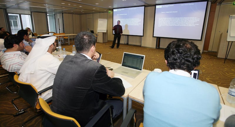 DUBAI, UNITED ARAB EMIRATES - JANUARY 18:  Students of the Cass Business School, University of London, Executive MBA Dubai Programme, listen to a lecture by Rob Melville, a Cass professor based in London, at a workshop at the DIFC in Dubai on January 18, 2009.  (Randi Sokoloff / The National)  For story by Michael Jalili. *** Local Caption ***  RS010-0118-CASS.jpg