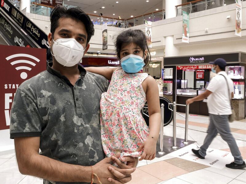 Abu Dhabi, United Arab Emirates, August 23, 2020.   
Kaashvi-3 goes around with her father with a face mask on in Al Wahda Mall, Abu Dhabi.
Victor Besa /The National
Section:  NA
Reporter: