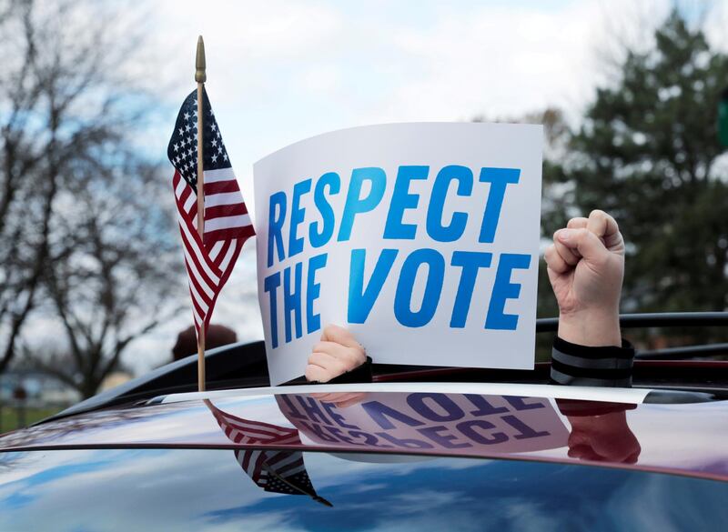 Demonstrators in a car caravan demand the Board of State Canvassers to certify the results of the election in Lansing, Michigan. Reuters