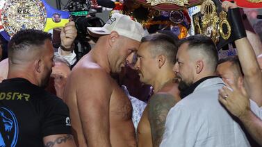 Tyson Fury and Oleksandr Usyk clash during the weigh-in in Riyadh, Saudi Arabia, on Friday. EPA