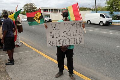 A Jamaican protester in Kingston makes his point as the Duke and Duchess of Cambridge visit the Caribbean. Reuters