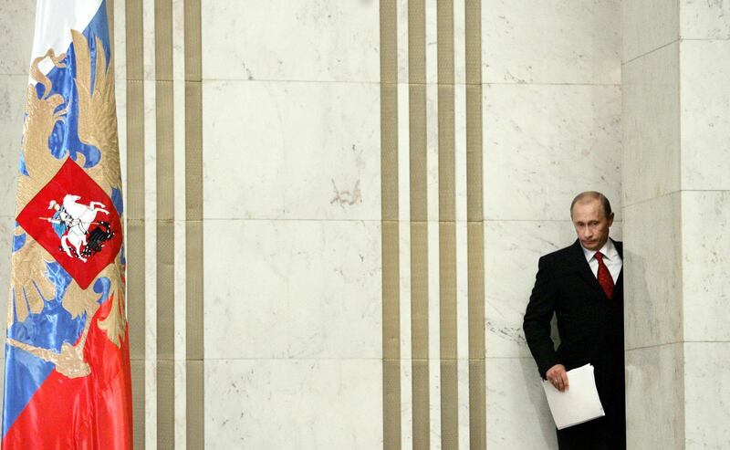 Putin enters for his annual press conference in Moscow on January 31, 2006. AFP