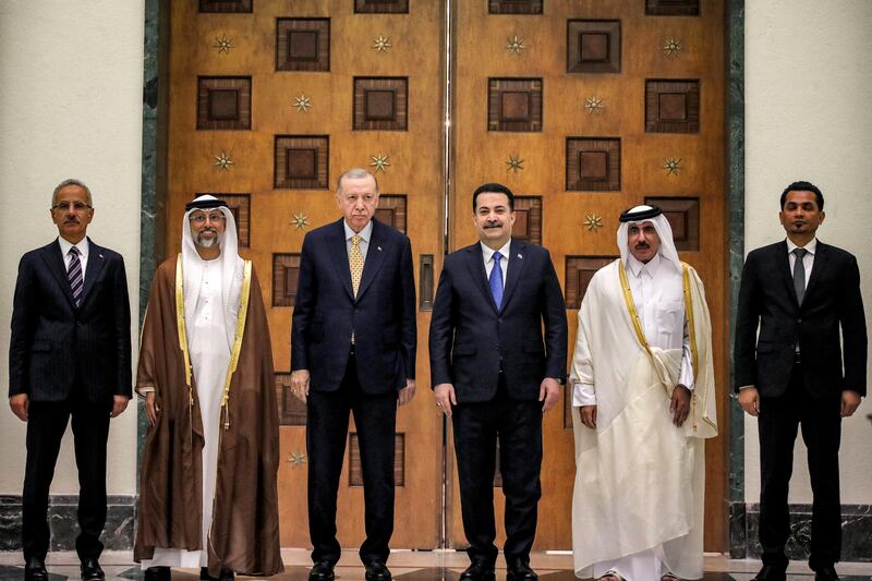 Suhail Al Mazrouei, UAE Minister of Energy and Infrastructure, second left, with Turkey's President Recep Tayyip Erdogan, third left, Iraq's Prime Minister Mohammed Shia Al Sudani, third right, Qatar's Minister of Transport Jassim Al Sulaiti, second right, Iraq's Transport Minister Razzaq Al Saadawi, right, and Turkey's Transport Minister Abdulkadir Uraloglu, left, during the signing of the Development Road framework agreement on security, economy, and development in Baghdad. Reuters