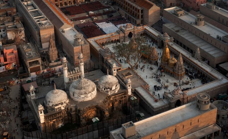 The Gyanvapi Mosque, left, stands next to the Kashivishwanath Temple on the banks of the Ganges river in Varanasi. AP