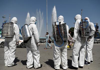 Men prepare to spray disinfectant during the coronavirus disease (COVID-19) outbreak in Kabul, Afghanistan June 18, 2020. REUTERS/Mohammad Ismail