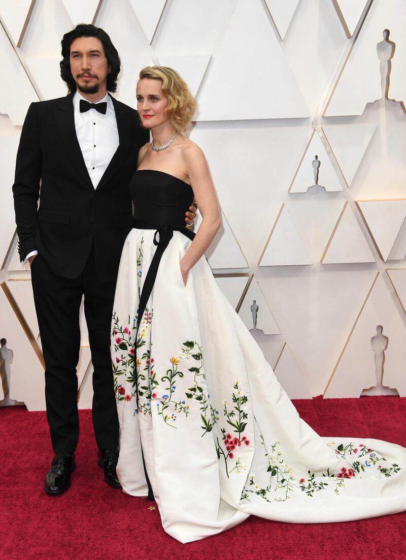 Adam Driver, wearing Burberry, and Joanne Tucker arrive at the Oscars on Sunday, February 9, 2020, at the Dolby Theatre in Los Angeles. AP