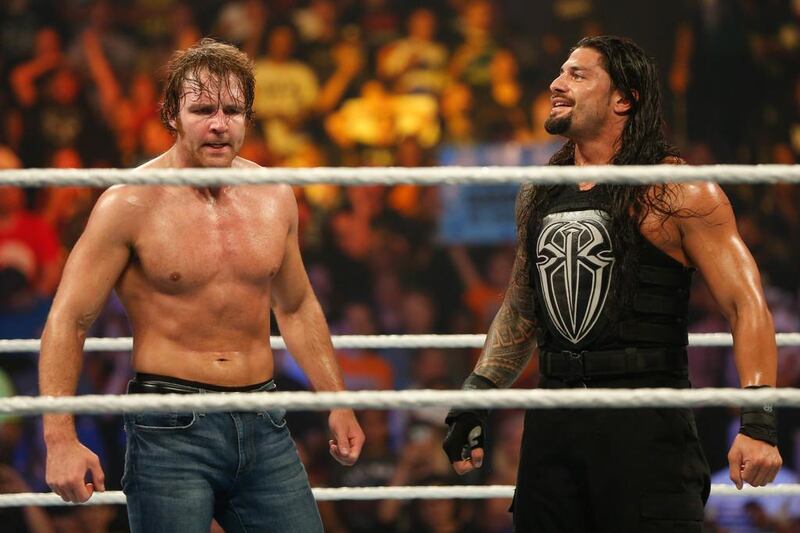 TLC promises to be a disappointing night for both Roman Reigns, right, and Dean Ambrose, left, as they lose their respective title matches, for expect Reigns to regain the WWE World Heavyweight title at the Royal Rumble next month. JP Yim / Getty Images / AFP